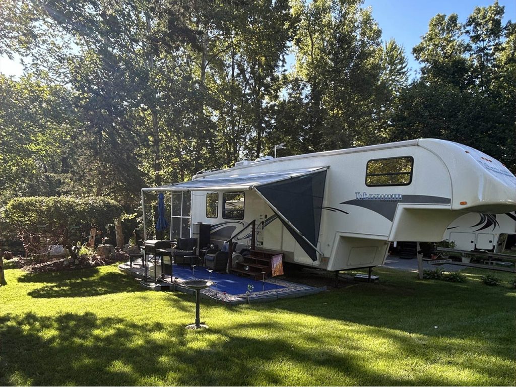 Seasonal RV Site Setup at Whispering Waters Campground Seasonal RV campsite setup with awning and outdoor living space at Whispering Waters Campground